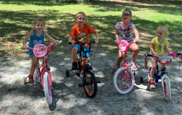 Lake Area Bikes - happy kids with their bicycles